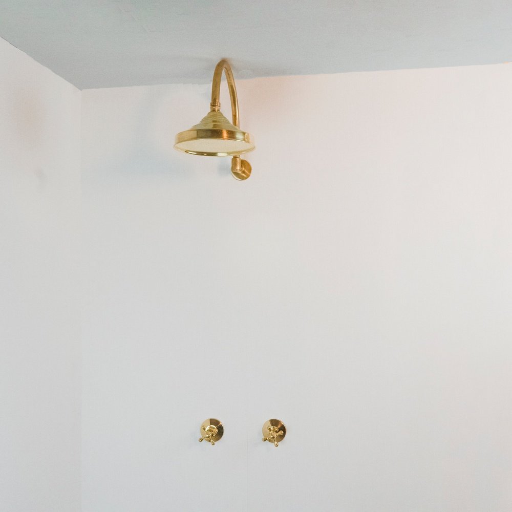 Handcrafted unlacquered brass shower system