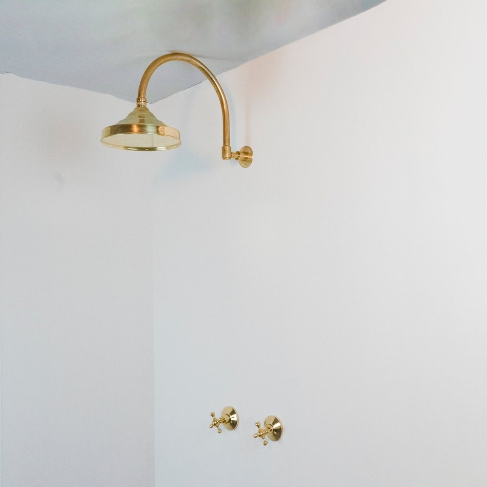 Handcrafted unlacquered brass shower system