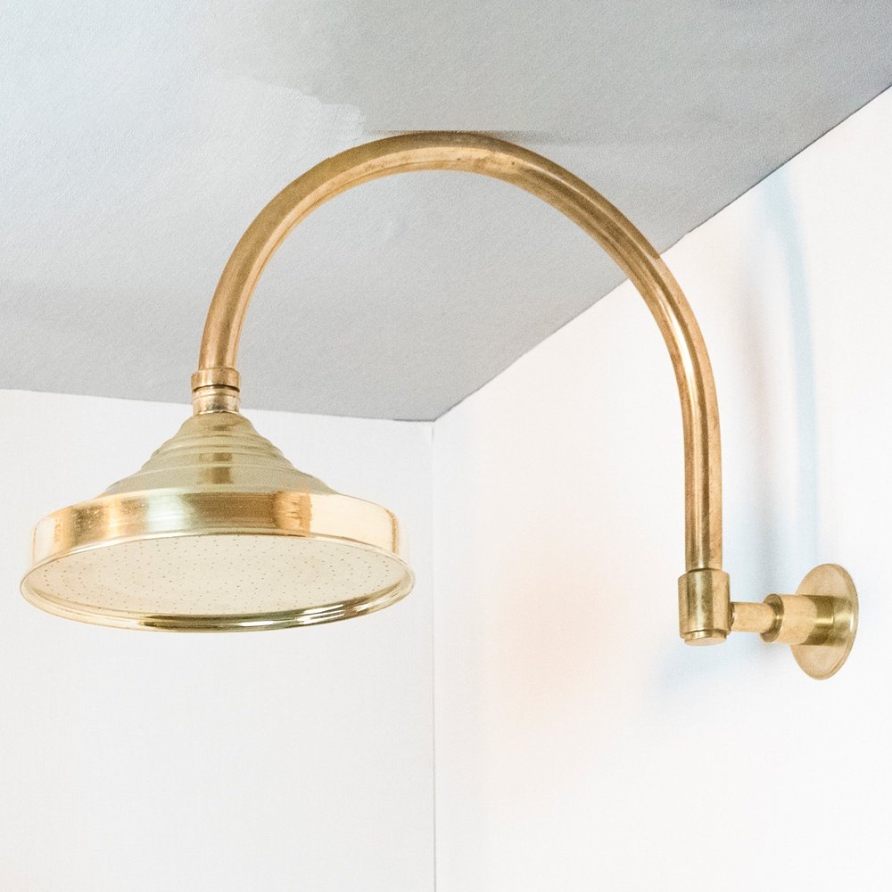 Handcrafted unlacquered brass shower system